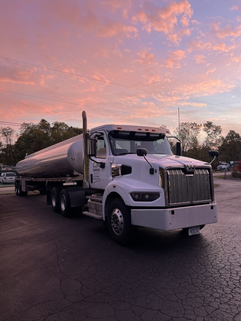Fuel distribution truck outside with sunset