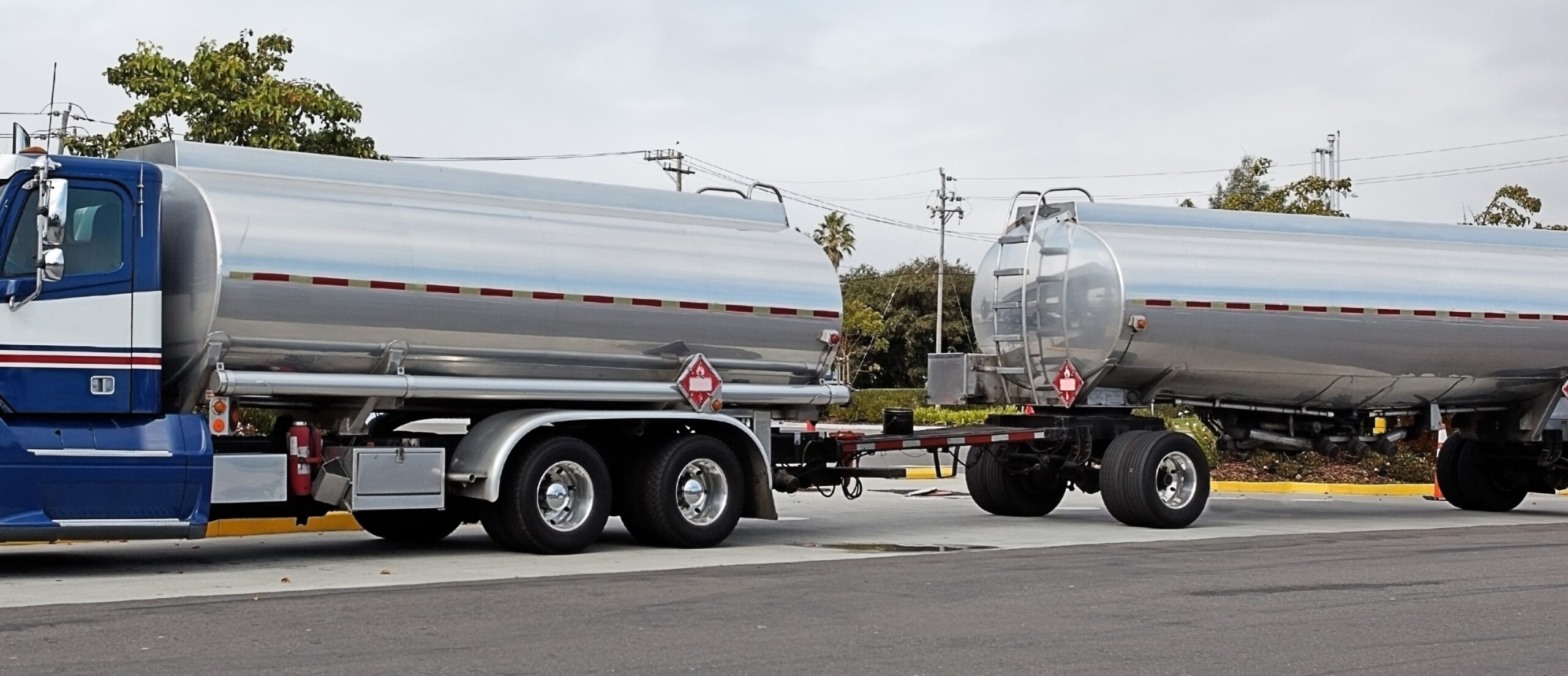 Large industrial truck with 2 silver tanks for fuel